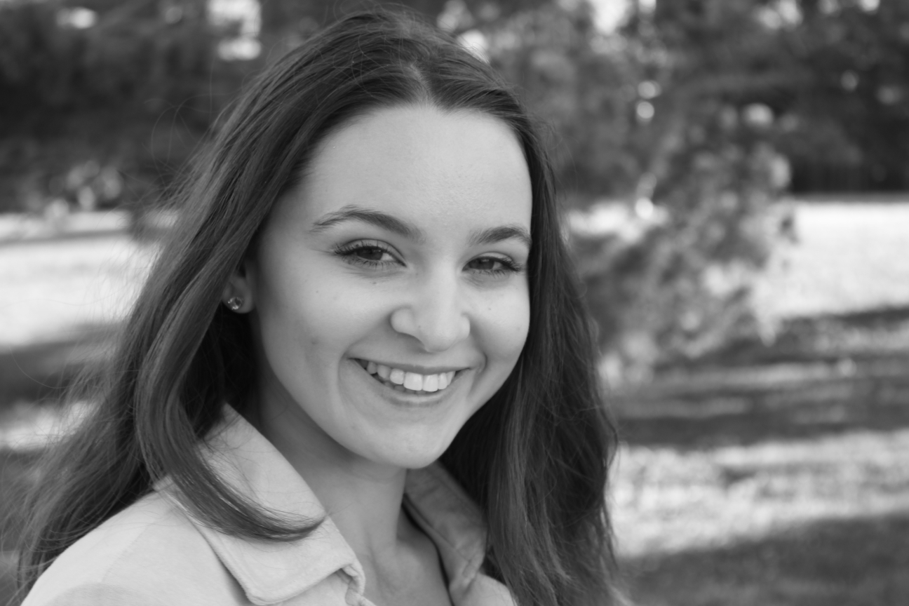 black and white head shot of female in the park